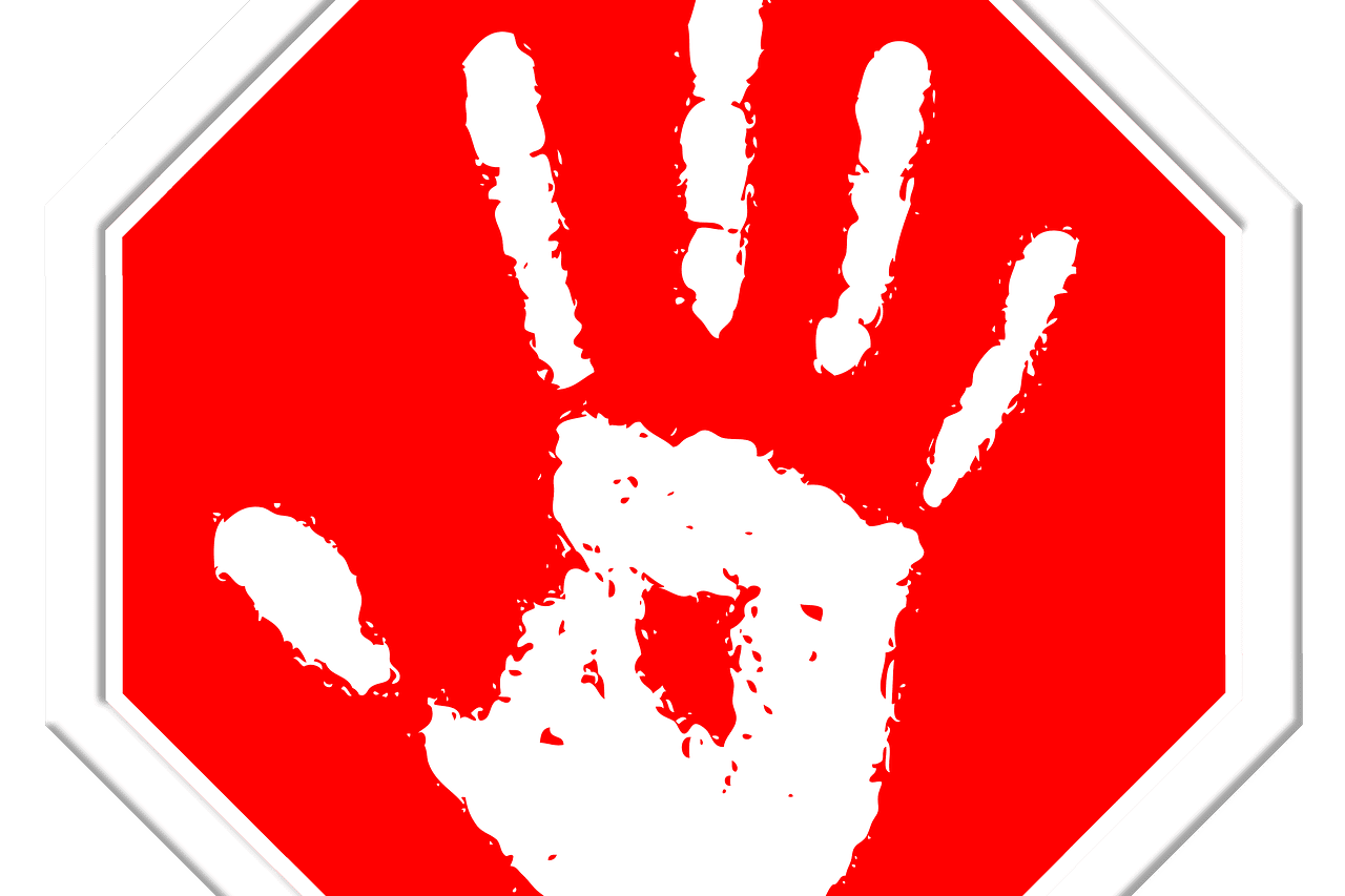 Achtkantiges Stoppschild mit wei&szlig;er Handabdruck-Illustration auf rotem Hintergrund.