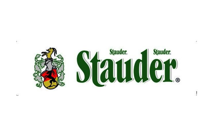 Logo der Marke Stauder mit einem Wappen und dem Schriftzug "Stauder" in gr&uuml;ner Schrift.