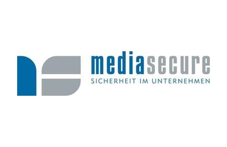 Logo von mediasecure mit Schriftzug &bdquo;Sicherheit im Unternehmen&ldquo; in Grau und Blau. Geometrische Formen sind sichtbar.
